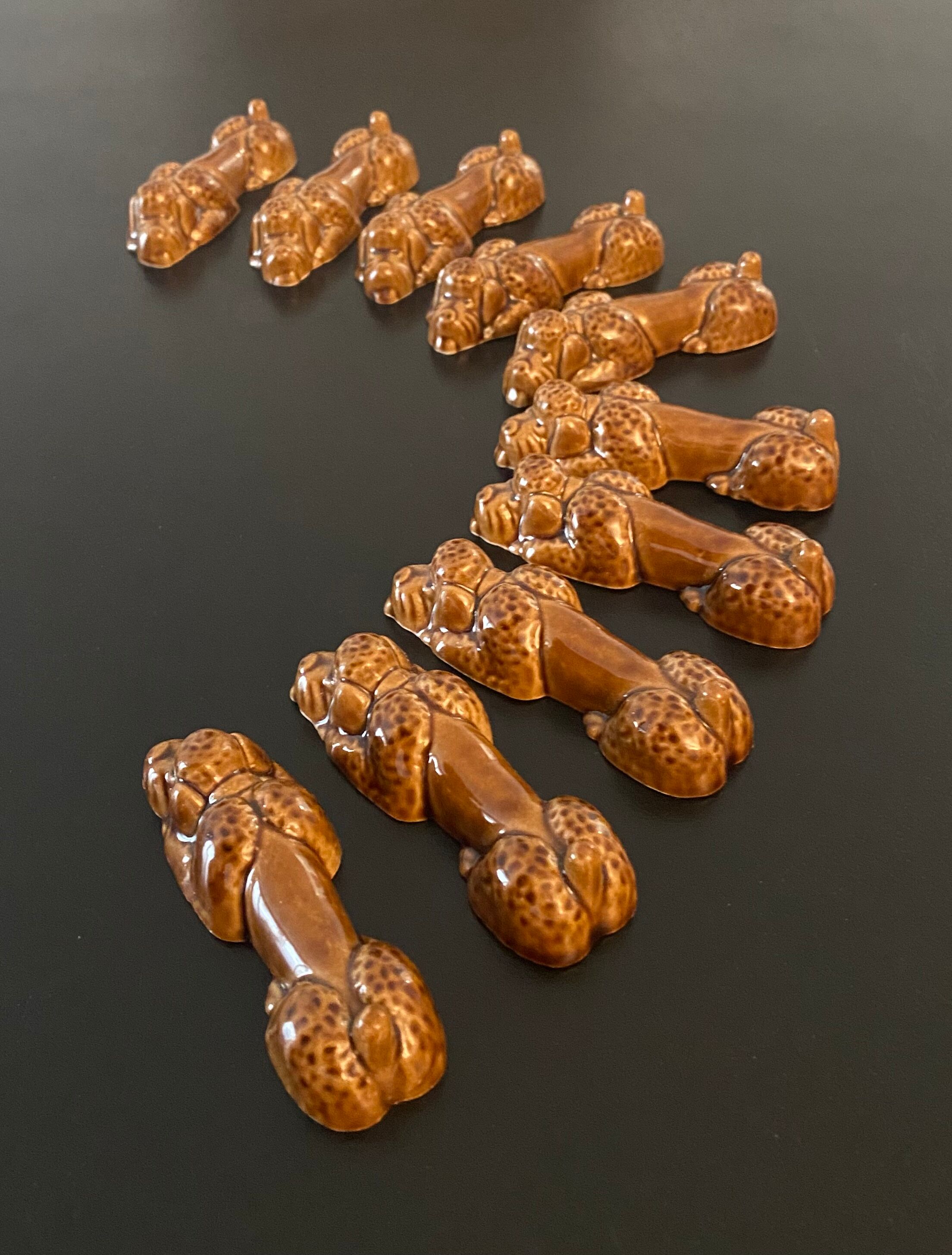 10 ceramic knife holders in the shape of a recumbent poodle