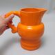 Pichet orange St Clément années 60