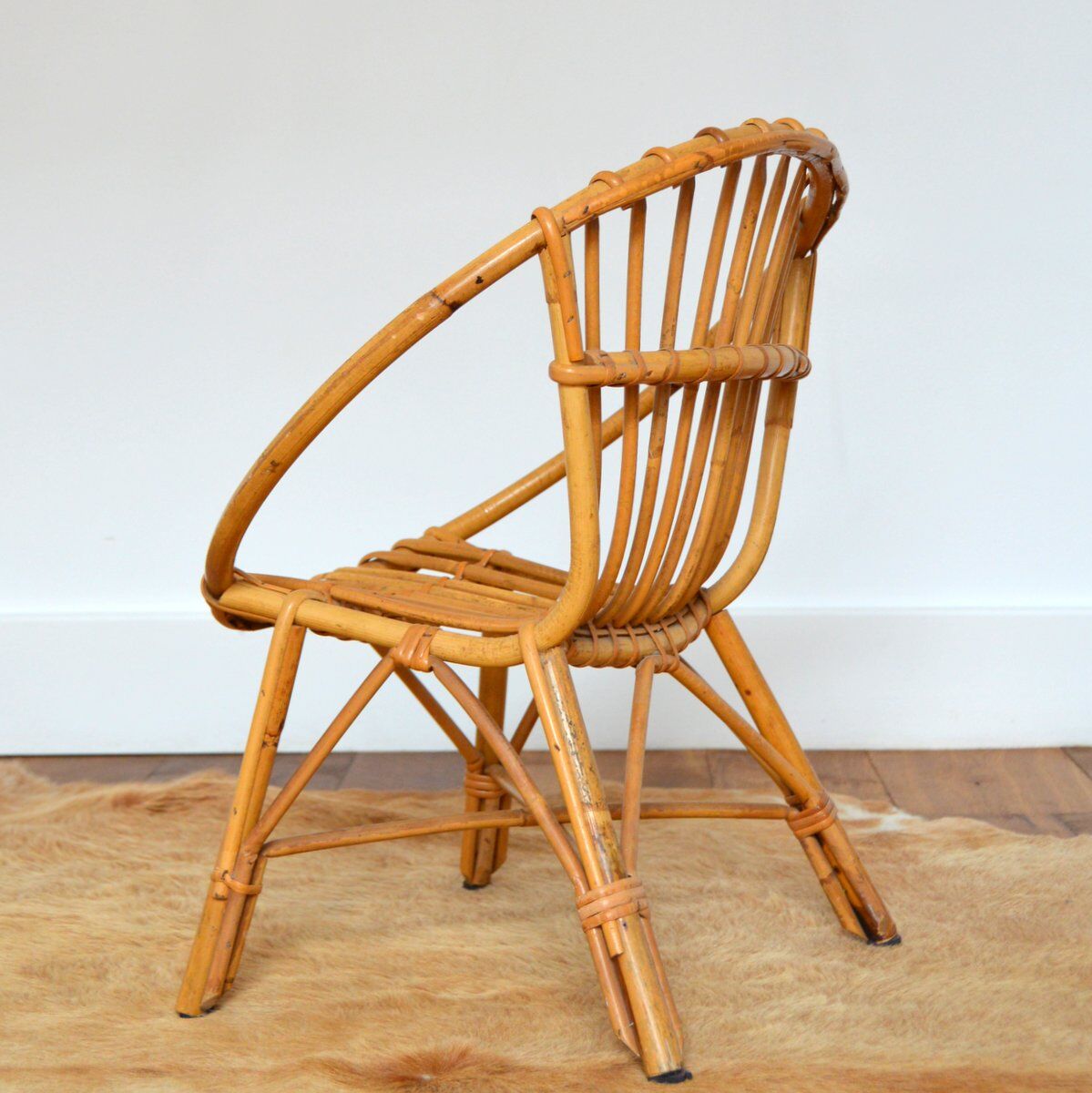 Children's shell armchair in rattan 1960s