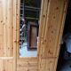 Wardrobe three doors, one with mirror, three drawers in solid pine wood