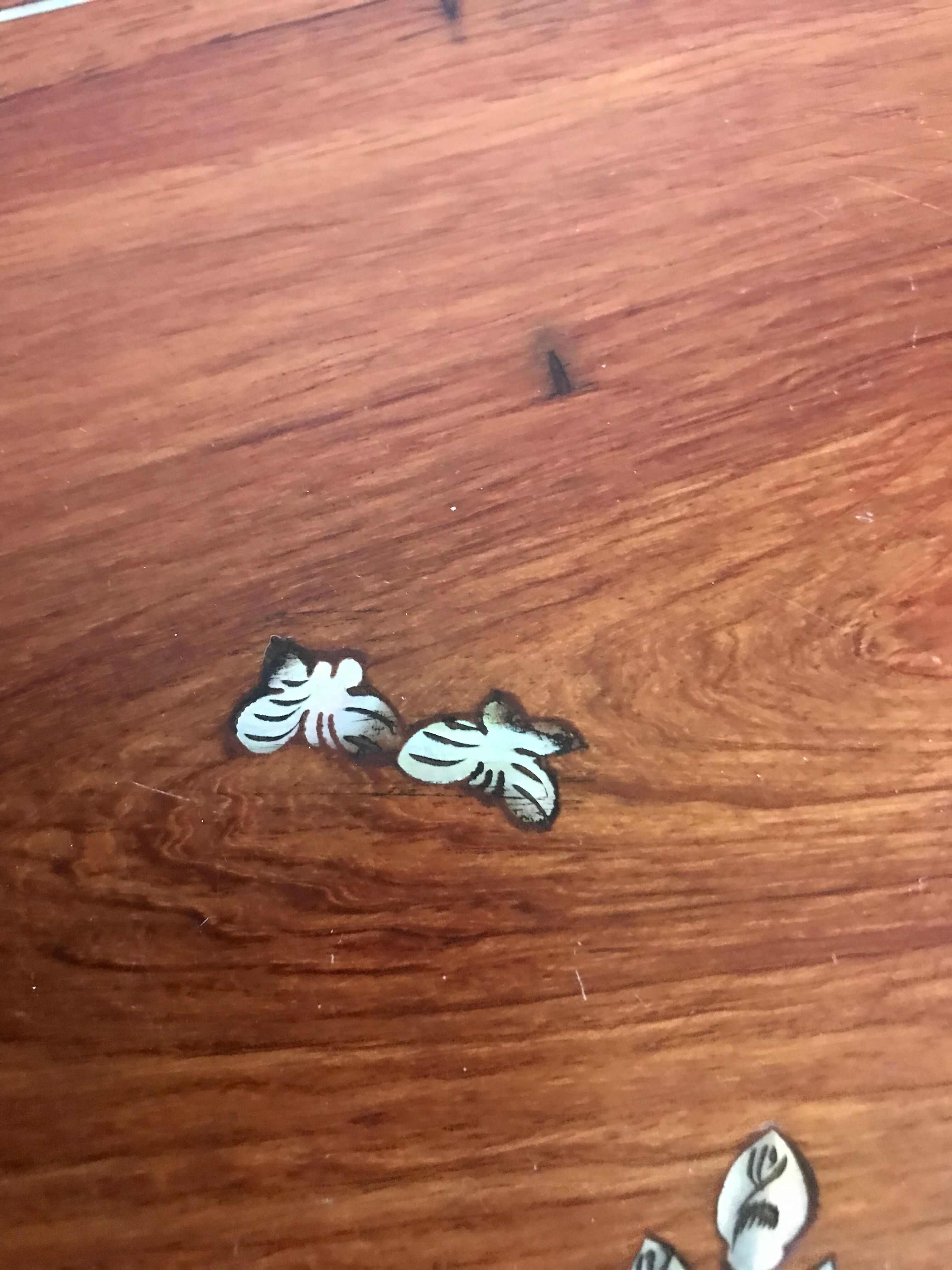 Wood and mother-of-pearl top