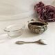 Silver metal salter and glass with salt shovel
