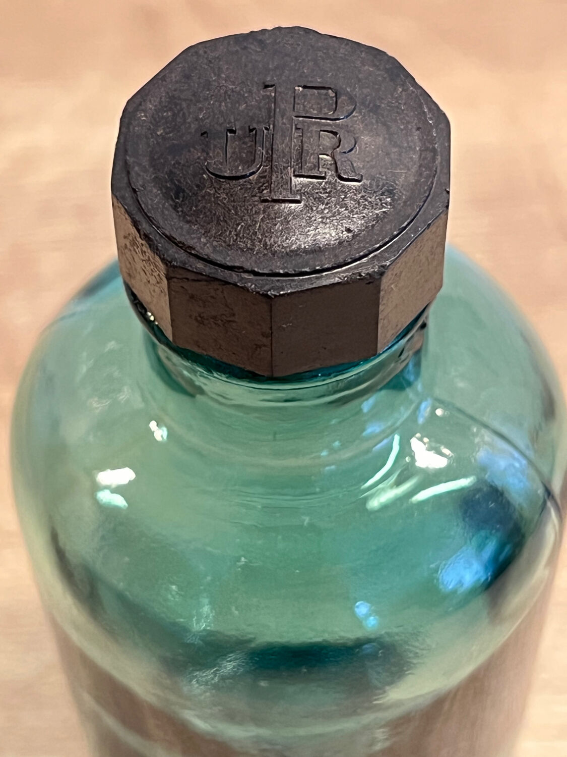 Small vintage dark turquoise blue bottle