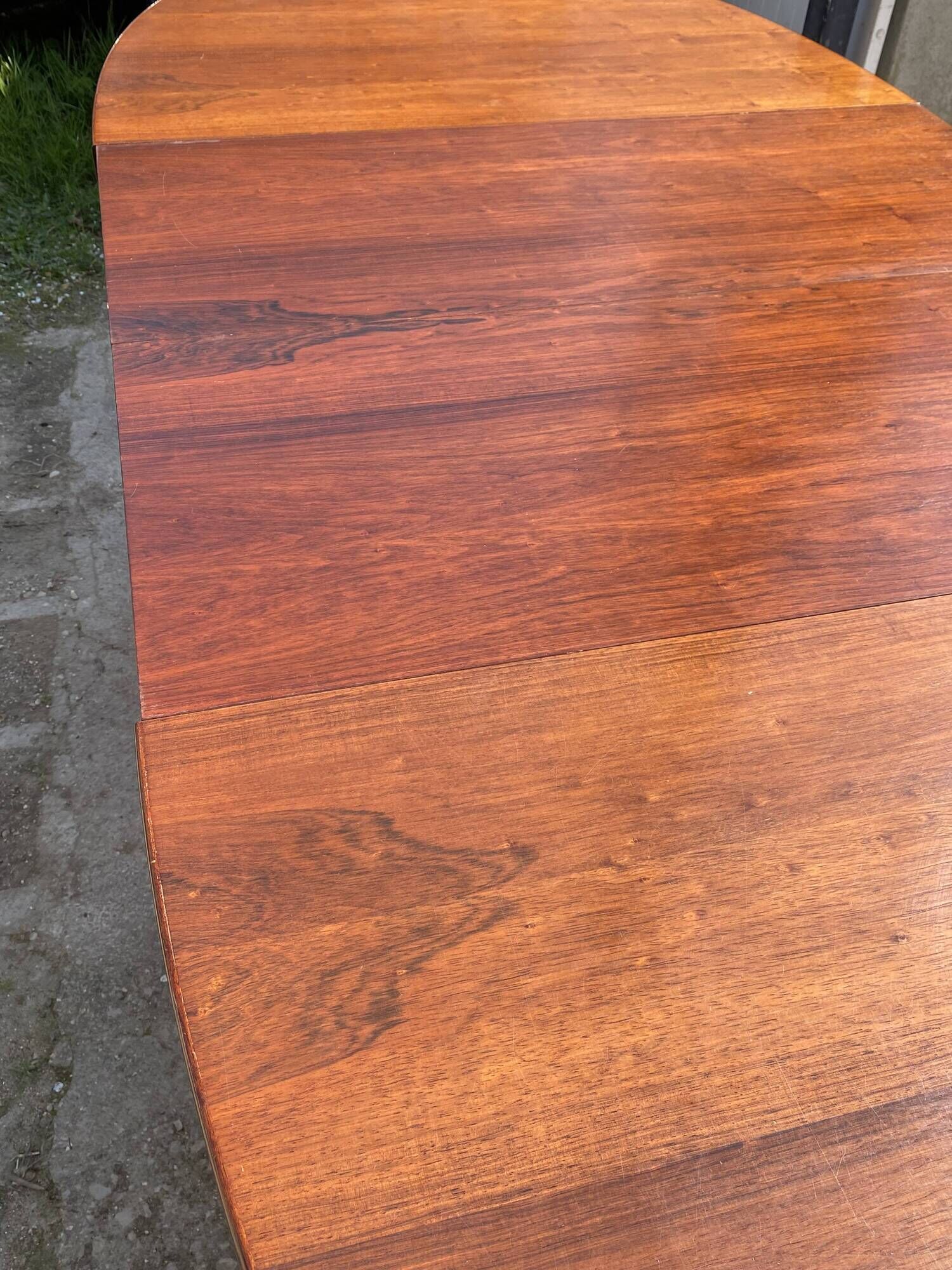 Baumann round oval extendable Scandinavian table in rosewood with 2 extensions.