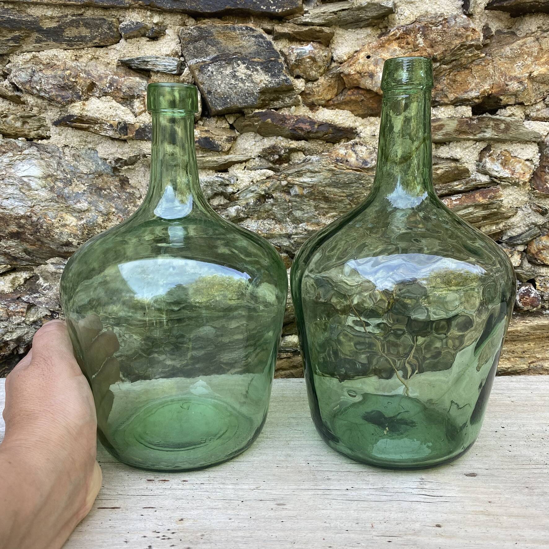 set of tinted glass demijohns