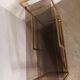 Brass shelf, smoked glass