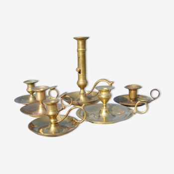 Set of 6 hand-held brass candlesticks from candle holders for display