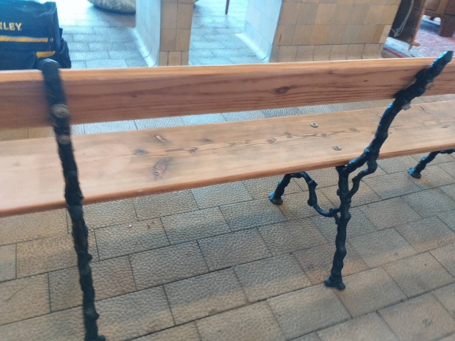 Antique garden bench with cast iron legs