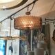 Patinated brass lurstre, and Murano glass