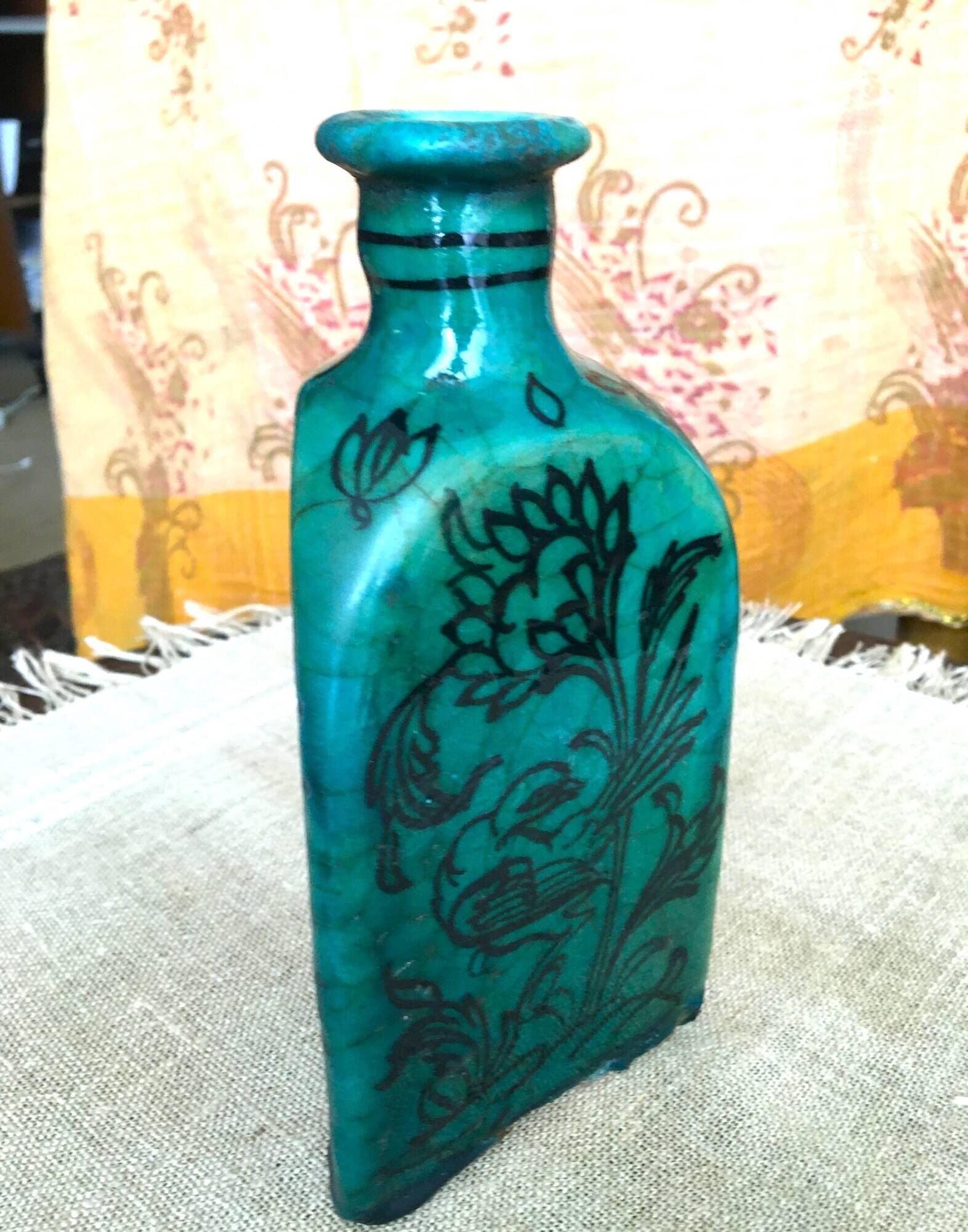 Antique Iranian three-sided blue ceramic bottle