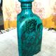 Antique Iranian three-sided blue ceramic bottle