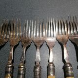 Old silver fish forks with bone handles