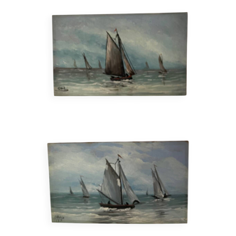 A pair of old paintings on wood.