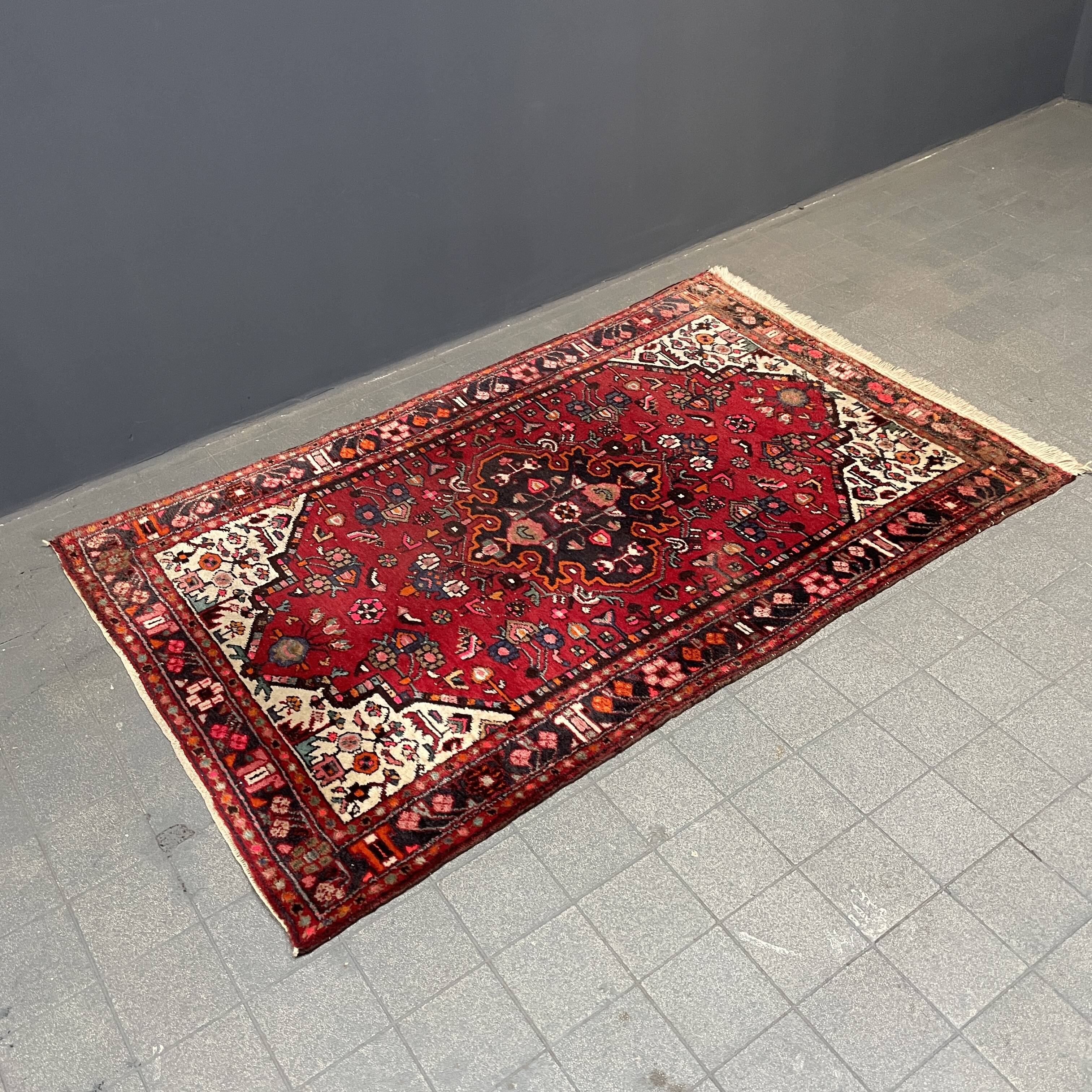 Worn vintage oriental rug or carpet