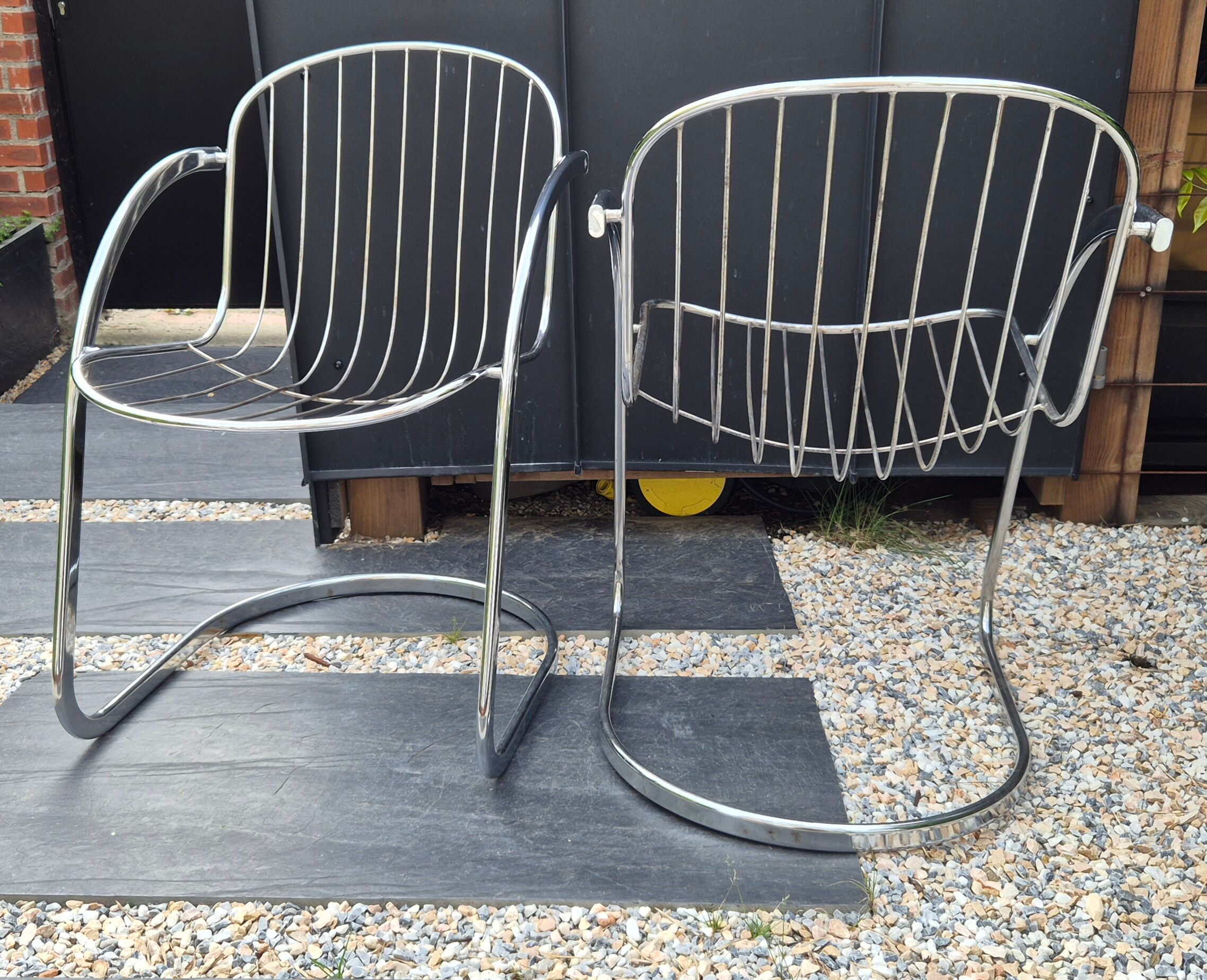 A pair of space age wire chairs
