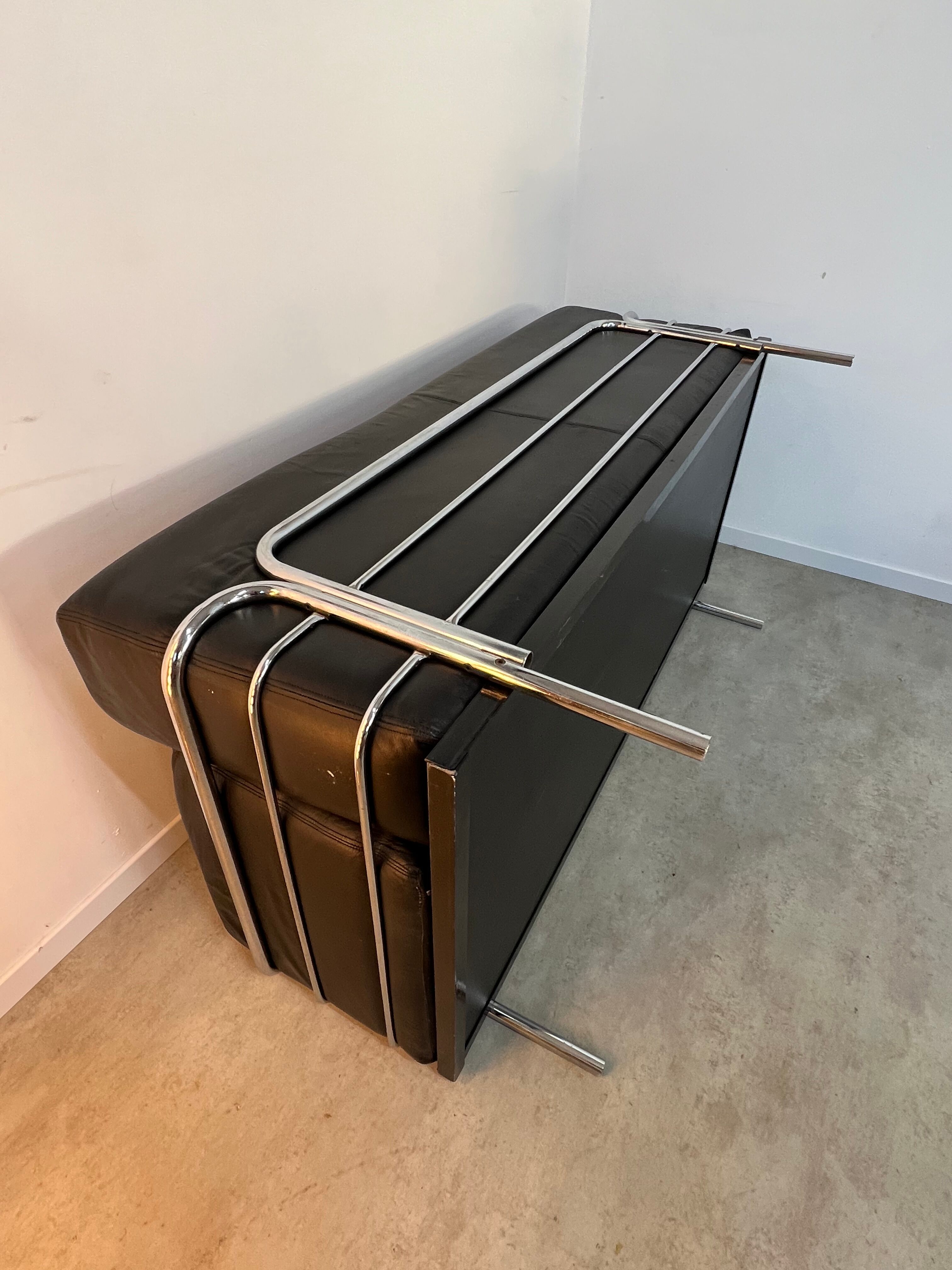 Old vintage leather and tubular metal sofa, design 70s
