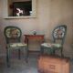 Antique chairs with studded upholstery.