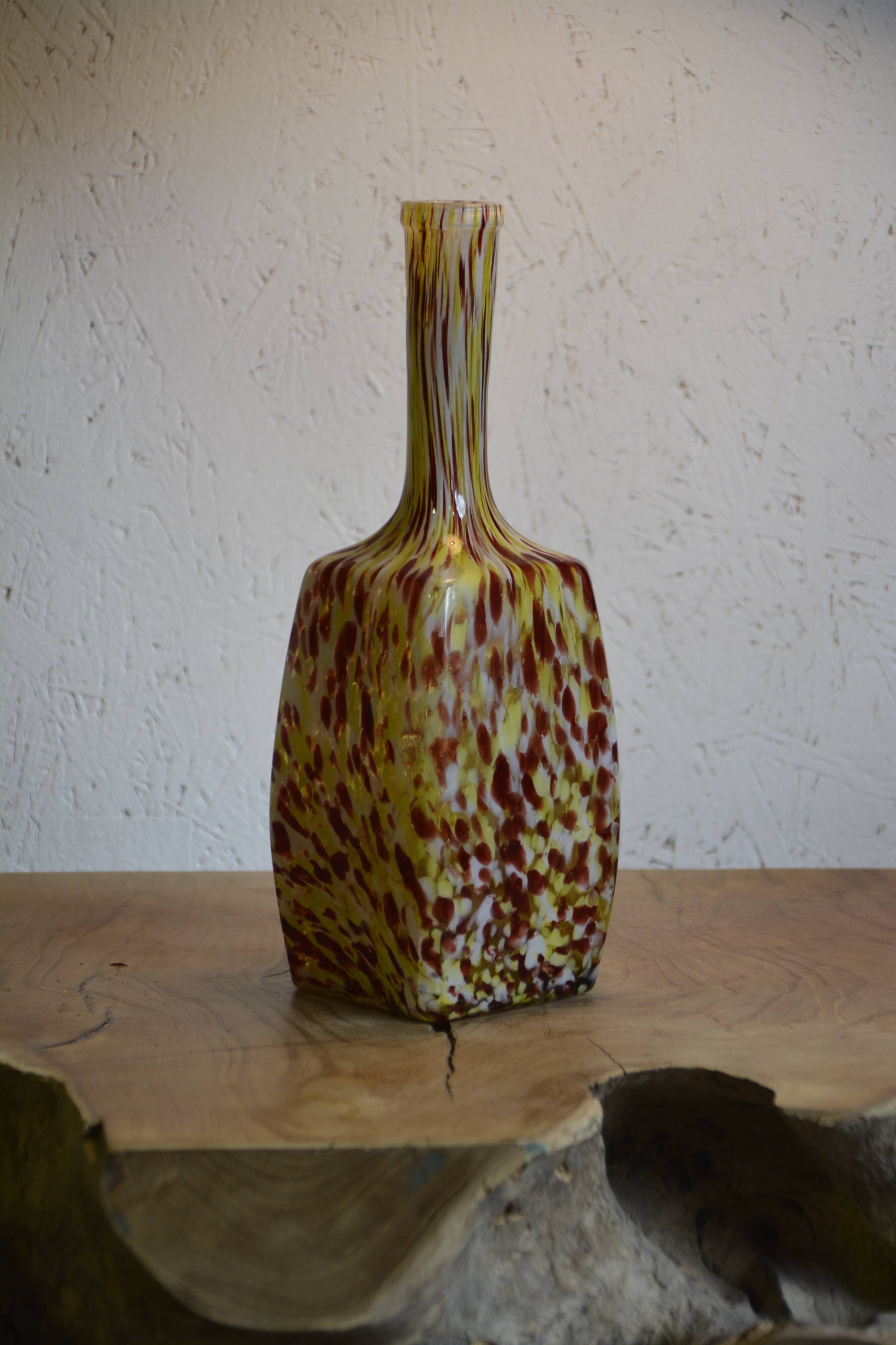 Yellow and white speckled decanter