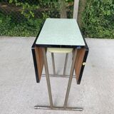 Folding and extending kitchen table in steel and aqua green wood