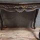 Antique desk in the Louis XV style, resting on four curved legs.