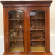 English showcase in two mahogany bodies and 19th century veneer