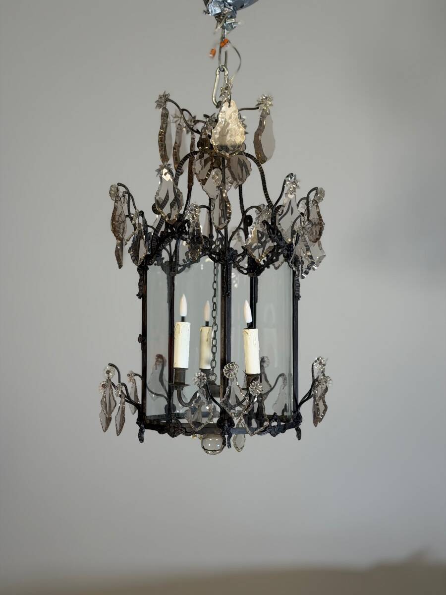 Louis XV style lantern in blackened brass adorned with cut crystal pendants, circa 1900.