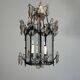 Louis XV style lantern in blackened brass adorned with cut crystal pendants, circa 1900.