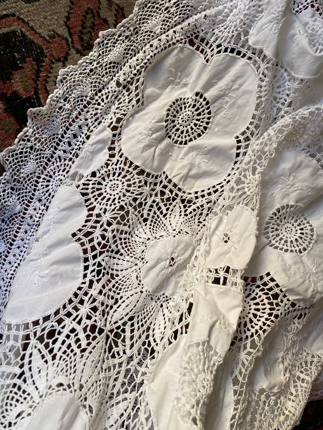 White cotton tablecloth with crochet lace.