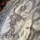 White cotton tablecloth with crochet lace.