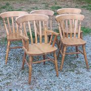 Set of 4 chairs and 1 armchair in mountain style made of oak.