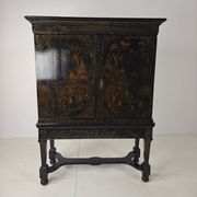 A rare early 18th-century Dutch japanned chinoiserie cabinet, circa 1700