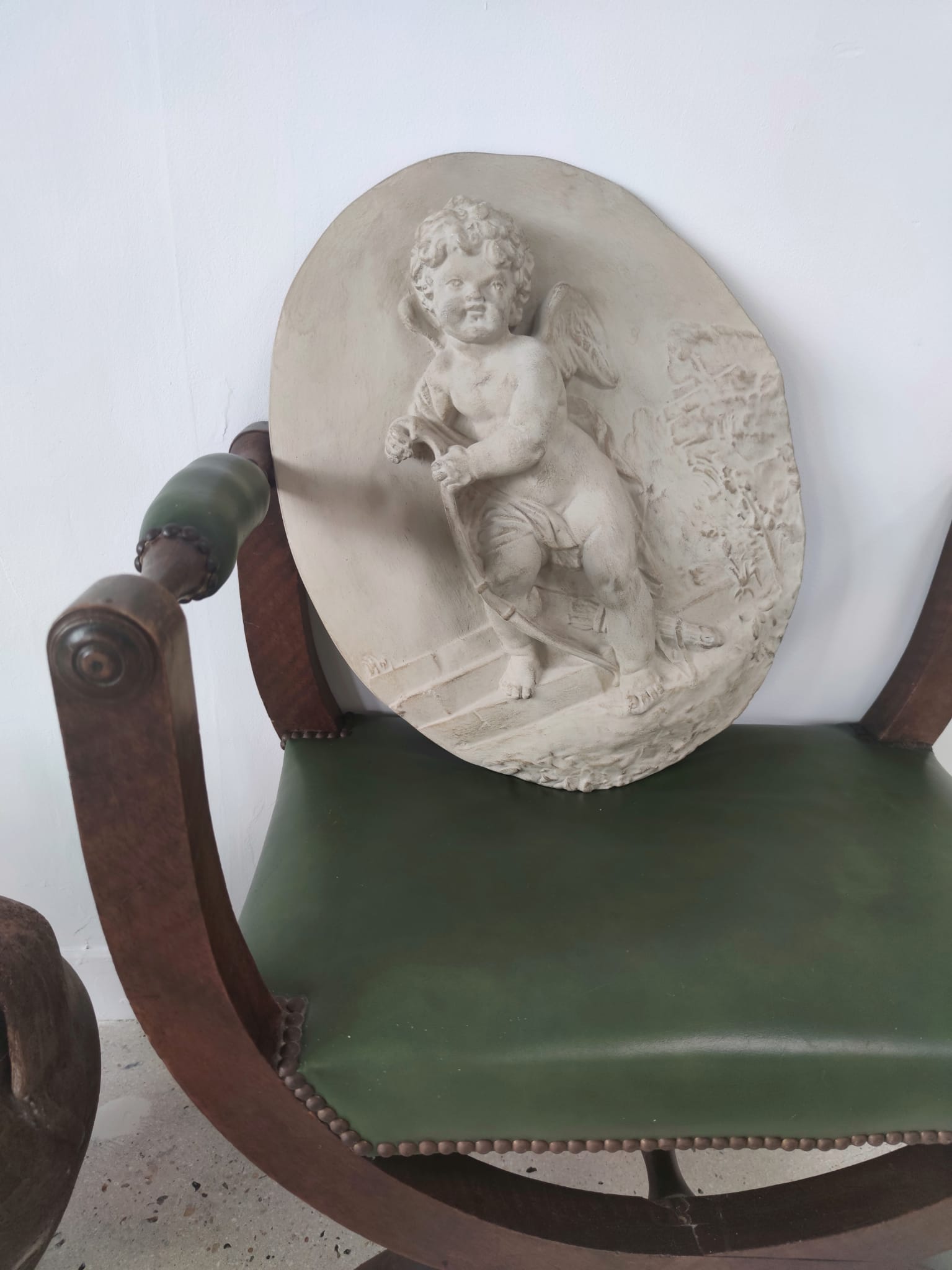 Green curule armchair