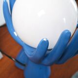 Ceramic lamp hands holding blue globe