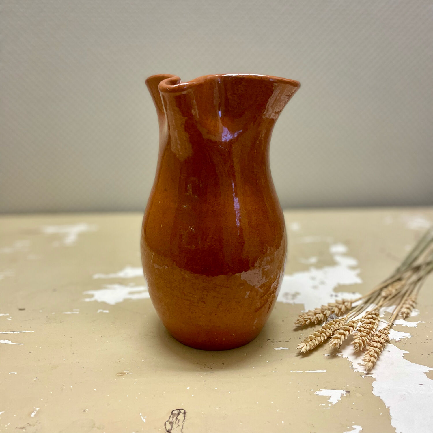 Vintage glazed terracotta pitcher