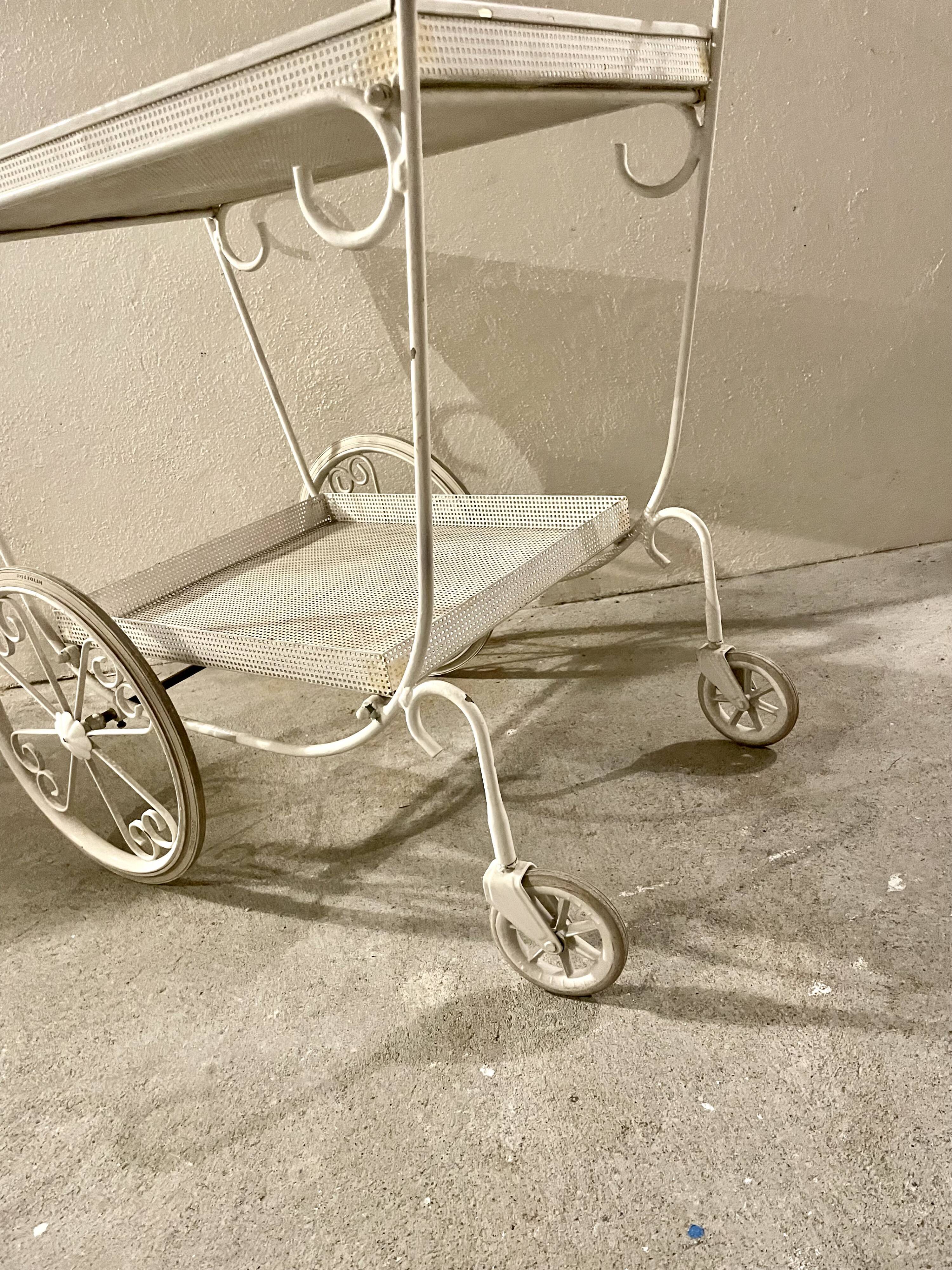 White perforated metal trolley