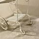 White perforated metal trolley