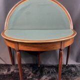 A Louis XVI period mahogany half-moon table forming a console/games table