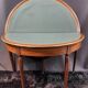 A Louis XVI period mahogany half-moon table forming a console/games table