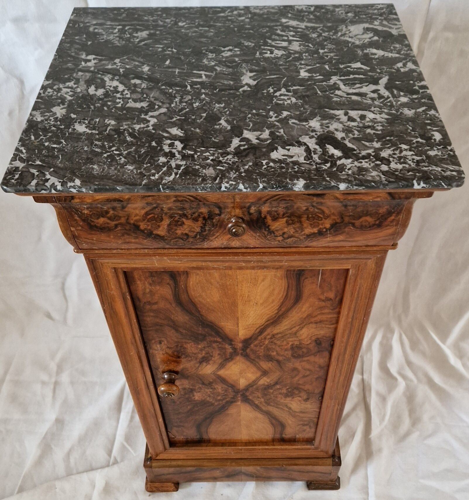 Elegant antique Napoleon III side table in walnut with black marble veneer.