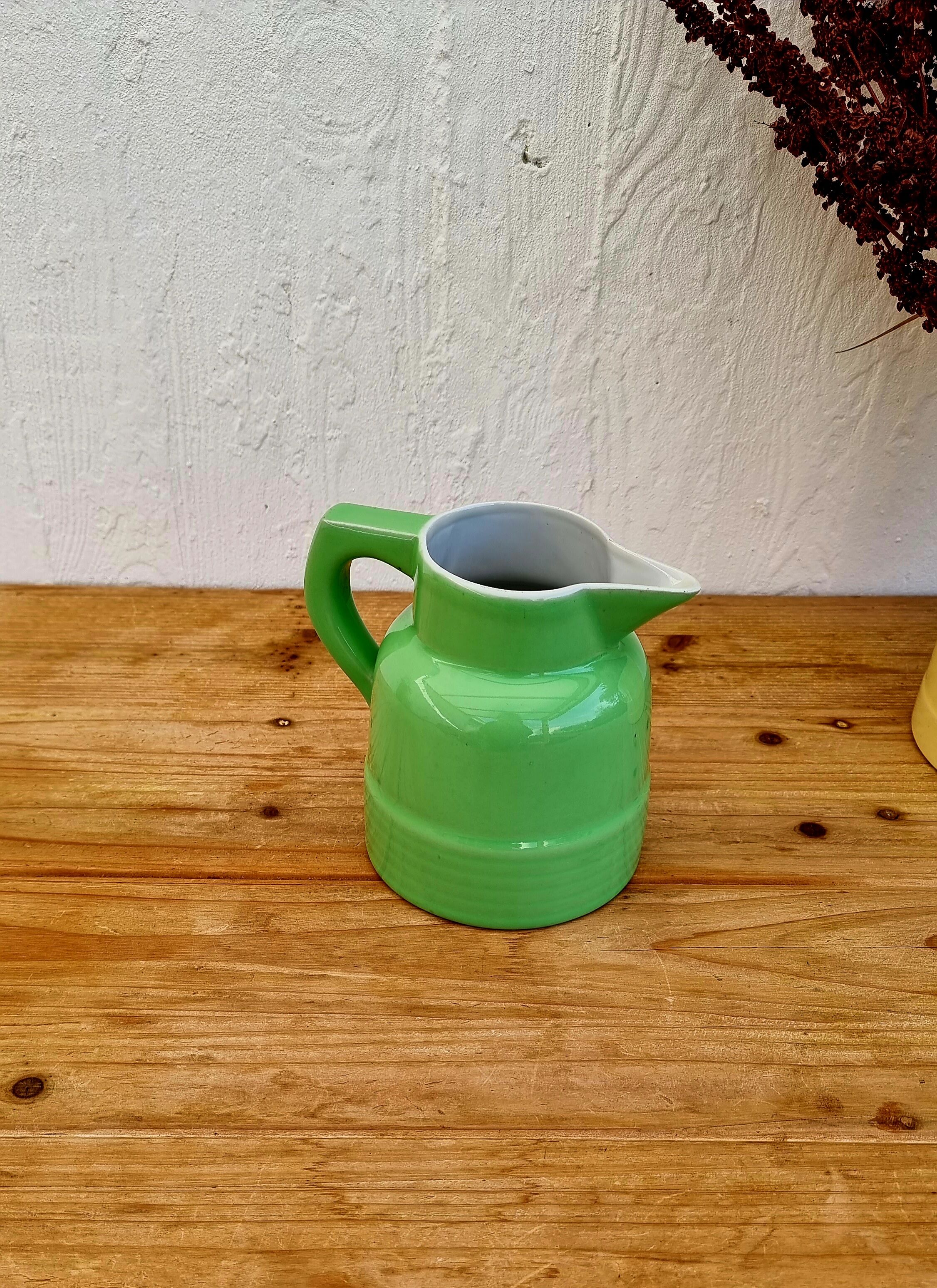 Vintage green earthenware pitcher