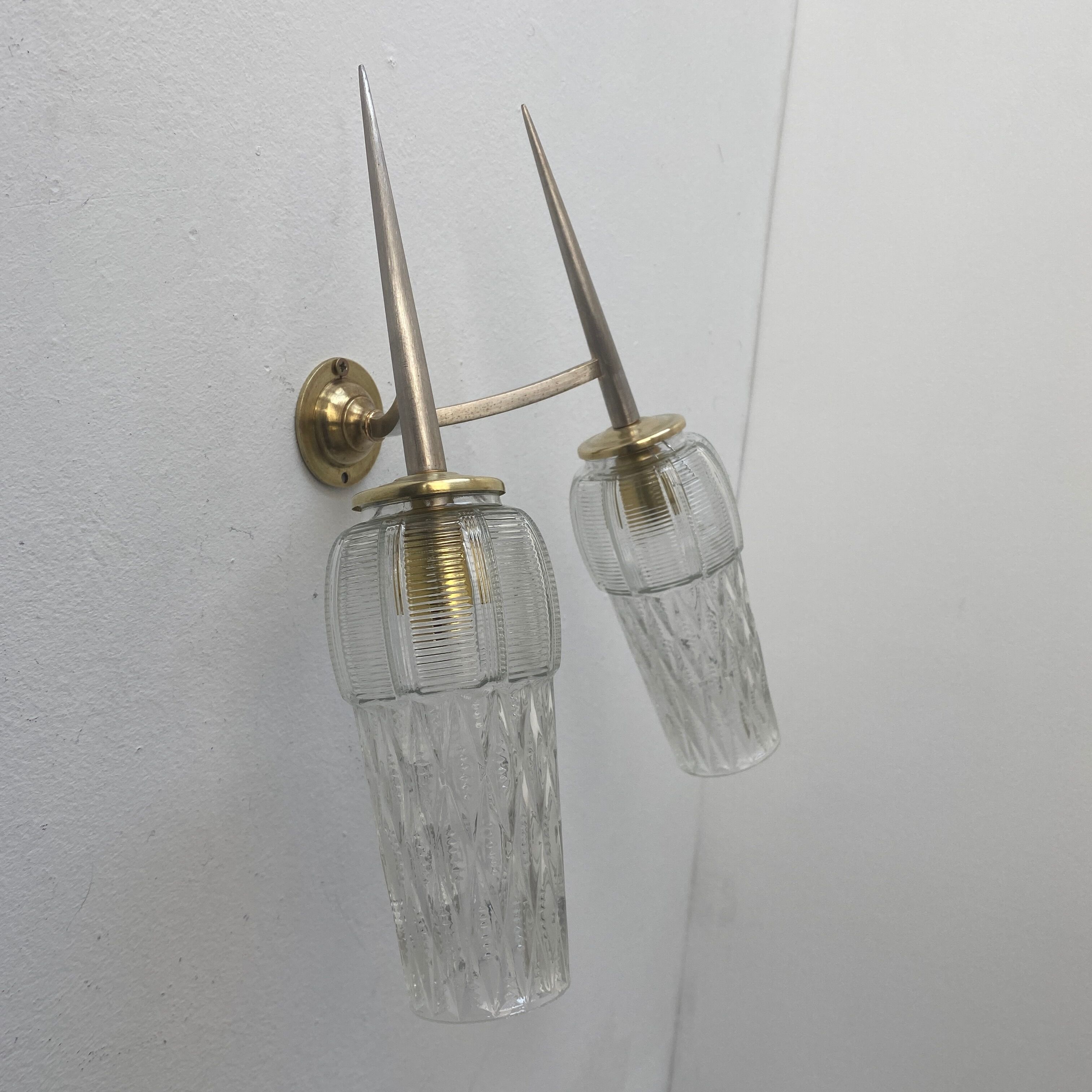 Old double wall lamp in vintage molded glass