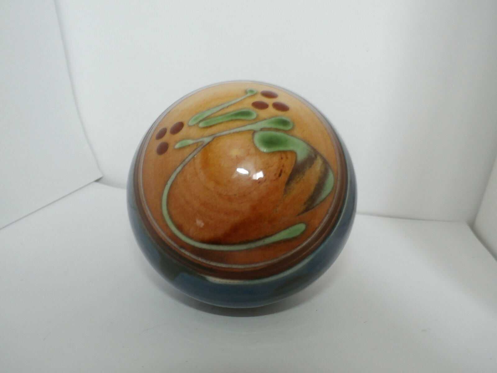 Glazed terracotta ball signed Otto Lindner