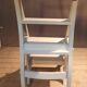 White chair convertible into a staircase.
