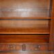 Corner library made of flamed hardwood, in 3 parts.