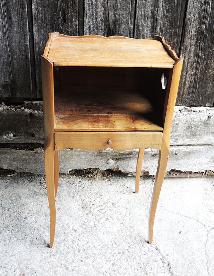 Old wooden bedside table heart pattern