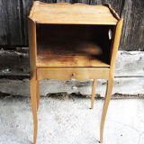 Old wooden bedside table heart pattern