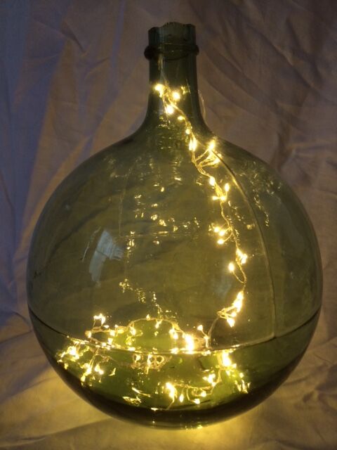 Demijohn old transparent green, estimated capacity around 12 to 15L