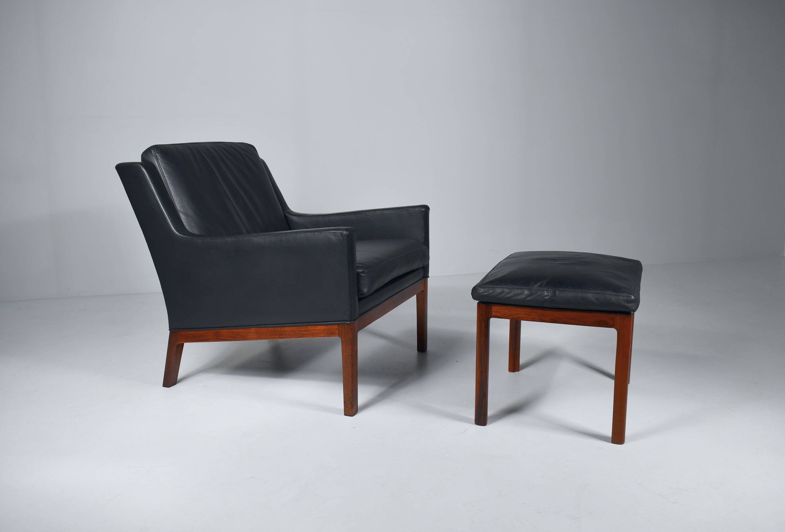 Leather armchair and footstool by Kai Lyngfeldt-Larsen. Denmark 1960s