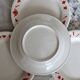 4 vintage porcelain dessert plates with red border and breakfast motif