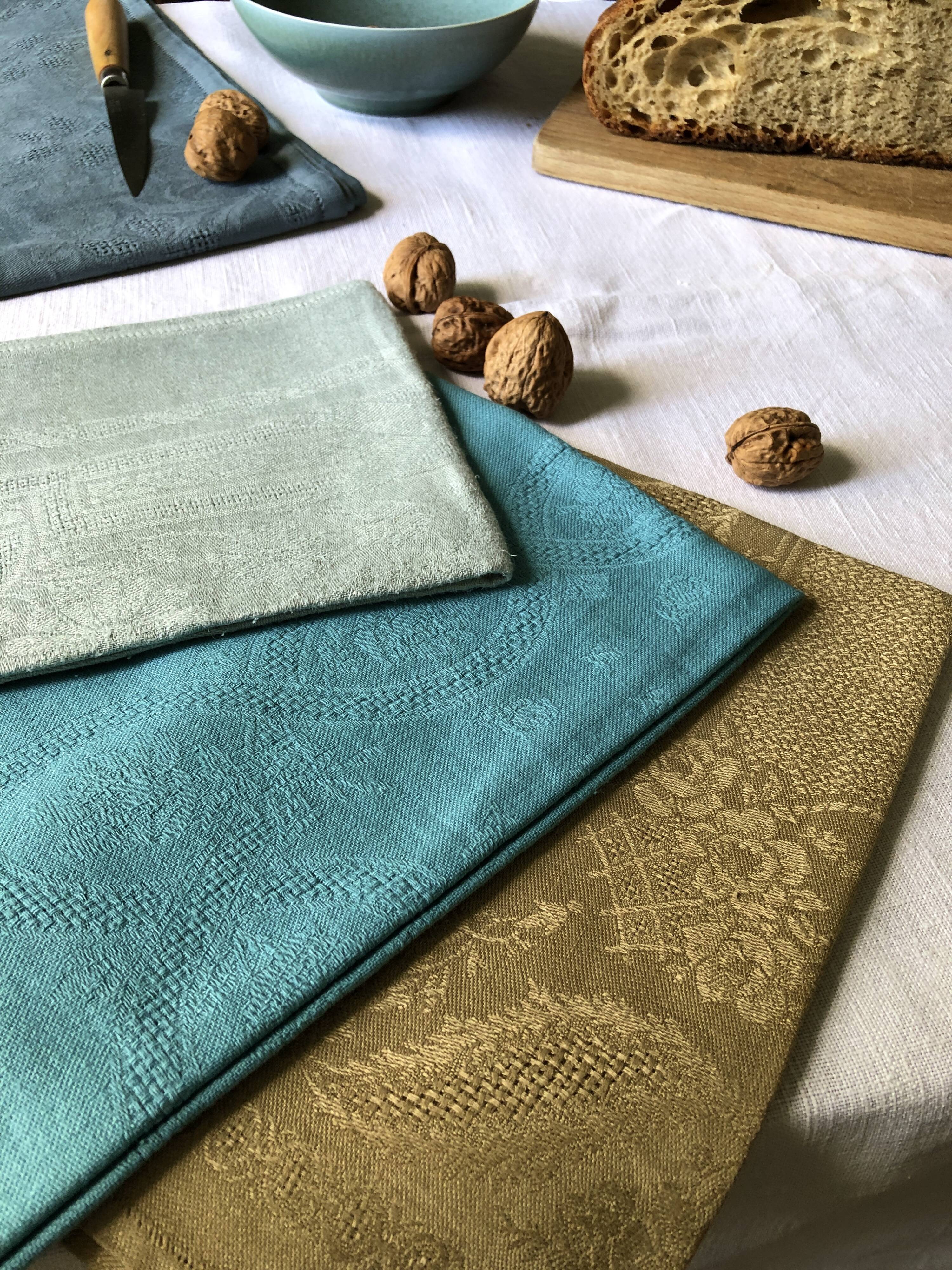 Suite of four tinted antique napkins